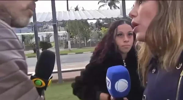 Lucas Martins, da Band, e Grace Abdou, da Record, discutem, ao vivo, durante reportagem  por Reprodução