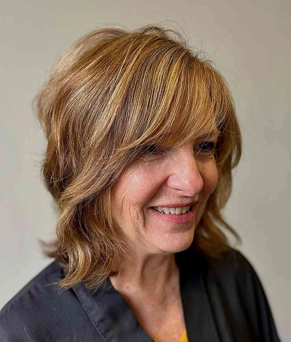 Long bob em camadas com franja cortininha por Reprodução/Instagram