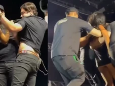 Imagem - Fã invade palco, rasga roupa e morde Natanzinho Lima em show; VÍDEO