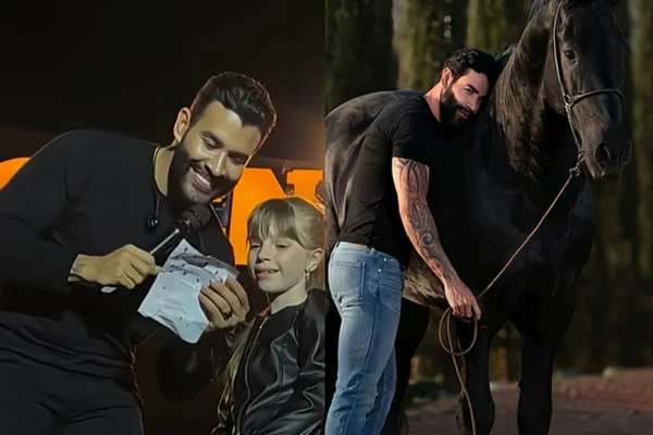 Gusttavo Lima e fã mirim em palco