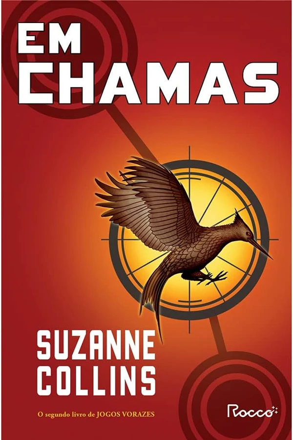 Em chamas, de Suzanne Collins (Rocco). Katniss Everdeen e Peeta Mellark, vencedores improváveis dos Jogos Vorazes, se tornam símbolos de revolta contra a Capital de Panem, forçados a fingir o romance e a enfrentar uma nova edição especial dos Jogos. por Reprodução