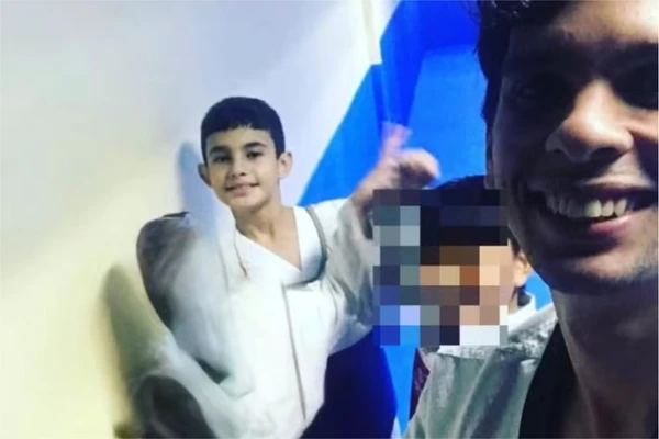 Cauã Batista e o treinador Luan por Divulgação