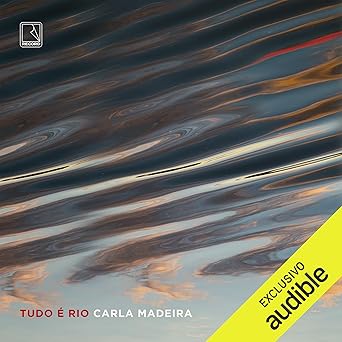 Audiolivro de Tudo é Rio, de Carla Madeira (Record). Com uma narrativa madura, precisa e ao mesmo tempo delicada e poética, o romance narra a história do casal Dalva e Venâncio, que tem a vida transformada após uma perda trágica, resultado do ciúme doentio do marido, e de Lucy, a prostituta mais depravada e cobiçada da cidade, que entra no caminho deles, formando um triângulo amoroso. por Reprodução