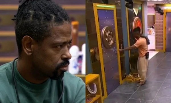 Leandro Boneco tenta apertar o botão de desistência após passar mal no BBB 26 por Reprodução/Globoplay 