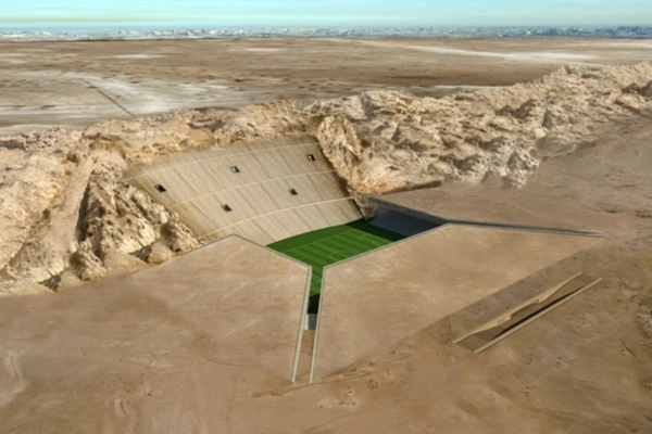 The Rock Stadium — Emirados Árabes Unidos: Ainda em projeto, o The Rock Stadium foi planejado para ser parcialmente subterrâneo e integrado a uma montanha no deserto dos Emirados Árabes Unidos. Além do visual futurista, a ideia é usar a própria estrutura rochosa como proteção natural contra o calor extremo da região. por Reprodução